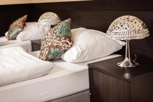 Postel nebo postele na pokoji v ubytování Hotel Willa Adriana
