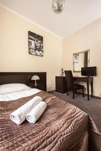 Postel nebo postele na pokoji v ubytování Hotel Willa Adriana