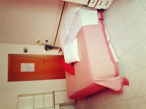 Postel nebo postele na pokoji v ubytování Hotel Giannella
