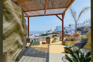 a view from the patio of a house at Canyon Santorini in Fira