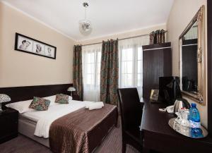 Postel nebo postele na pokoji v ubytování Hotel Willa Adriana