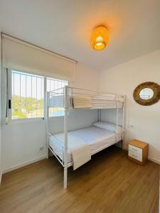 Posteľ alebo postele v izbe v ubytovaní Apartamento Deluxe Torremar