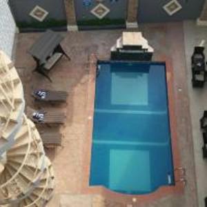 an overhead view of a room with a blue table at Valley Front View Hotel in Ikeja