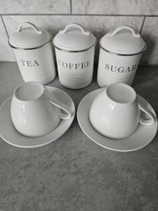 a group of four cups and saucers on plates at Edgerton Studios in Huddersfield +21 photos