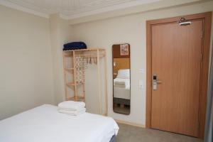 Postel nebo postele na pokoji v ubytování No 22 Riders' Inn
