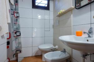 a bathroom with a sink and a toilet at Villa Assunta in Lecce