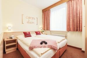 Postel nebo postele na pokoji v ubytování Le Petit CHARME-INN