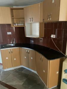 a kitchen with a sink and a counter top at SILVER SLOPES RESORT AND SPA in Kagio