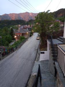 an empty street with mountains in the background at Tzoumerka Panorama in Pramanta