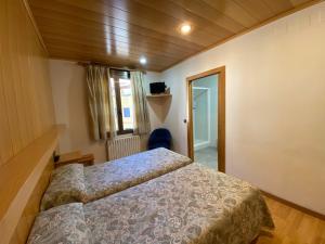 Postel nebo postele na pokoji v ubytování Hotel Sant Antoni