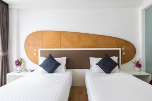 Кровать или кровати в номере Hotel Icon Bangkok Sukhumvit 2