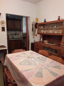 a kitchen with a table with a pattern on it at Alloggio Silvia in Lisio