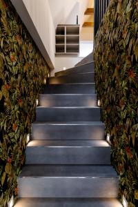 a staircase in a house with lights on it at Altstadt Apartments in Friedrichstadt