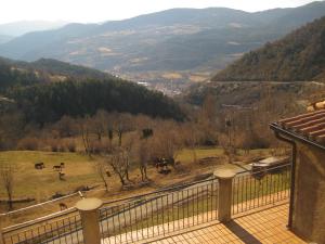 a view of a valley with horses in a field at Casa Enriu-Alojamiento y desayuno in Vilaller