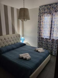 Postel nebo postele na pokoji v ubytování cico appartamento