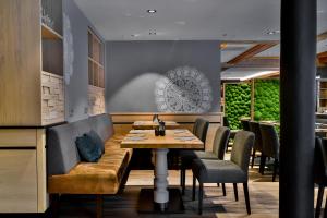 Posezení v ubytování Boutique Hotel Erb München Parsdorf