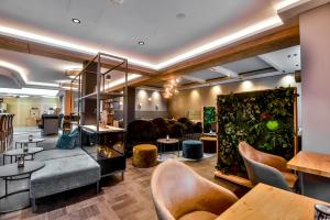 Posezení v ubytování Boutique Hotel Erb München Parsdorf