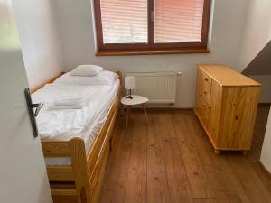 Ένα ή περισσότερα κρεβάτια σε δωμάτιο στο Sunny Attic Apartment +2 φωτογραφίες