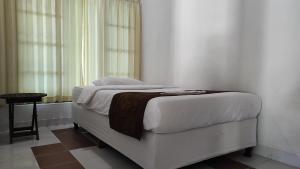 Ein Bett oder Betten in einem Zimmer der Unterkunft Keyani Bungalows Lovina