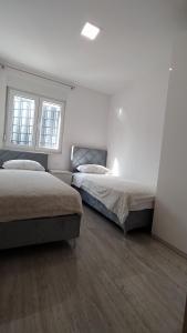 Postel nebo postele na pokoji v ubytování Primošten Pool Fantasy apartmant