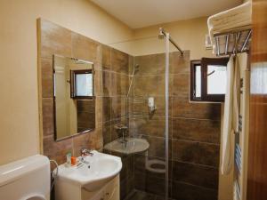 a bathroom with a sink and a shower at Casa Laptici - statiunea Pestera-Padina, Bucegi in Moroeni +87 photos