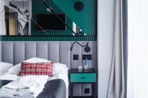 TV a/nebo společenská místnost v ubytování Rysy Boutique Hotel