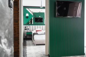 TV a/nebo společenská místnost v ubytování Rysy Boutique Hotel