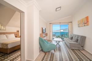 Postel nebo postele na pokoji v ubytování Moda Beach Hotel
