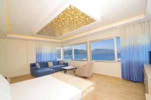 Postel nebo postele na pokoji v ubytování Moda Beach Hotel