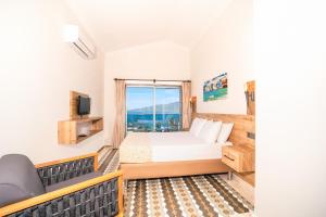 TV a/nebo společenská místnost v ubytování Moda Beach Hotel