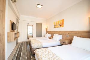 Postel nebo postele na pokoji v ubytování Moda Beach Hotel