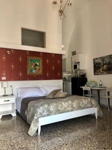 Postel nebo postele na pokoji v ubytování B&B dai Mimmi