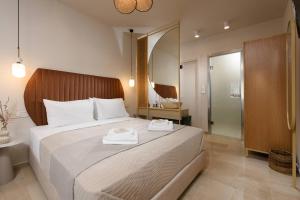 Ένα ή περισσότερα κρεβάτια σε δωμάτιο στο Ξενοδοχείο Βίλλα Νατάσα