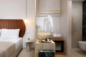Кровать или кровати в номере Hotel Villa Natassa