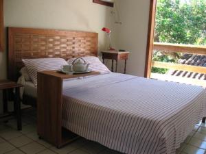Кровать или кровати в номере Pousada Girassol