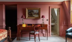 a bedroom with a desk and a chair and a bed at Batty Langley's in London