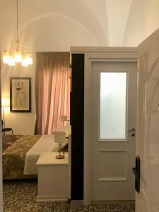 Postel nebo postele na pokoji v ubytování B&B dai Mimmi