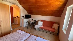 a living room with a couch and a table at Apartment 39 in Vir