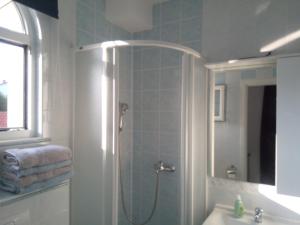 a bathroom with a shower and a sink at Ana Rooms in Krk