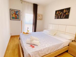 Posteľ alebo postele v izbe v ubytovaní Sunset Bay Vilanova