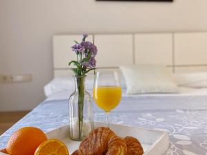 Posteľ alebo postele v izbe v ubytovaní Sunset Bay Vilanova