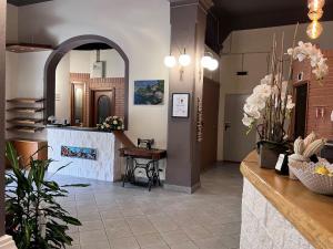 a lobby of a restaurant with a fireplace at Eden Hotel in Deiva Marina