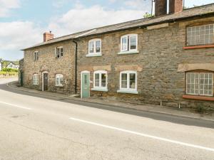 a brick building on the side of a street at 4 Wallflower Row in Hereford