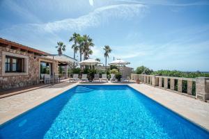 a swimming pool in the backyard of a villa at Sa Marina des torrent - Grupo Berna in Ses Salines