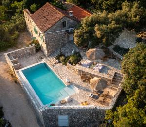 an aerial view of a house with a swimming pool at Nera Etwa House in Lovorje