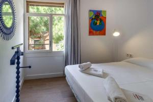 Postel nebo postele na pokoji v ubytování Urcatusa Migjorn 42 Apto 3 Dorm con piscina + 25 fotografií