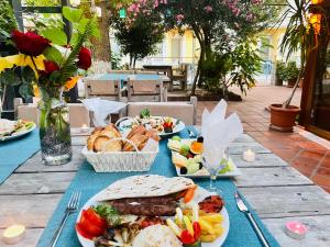 a table with plates of food on top at Mountain Valley Oludeniz in Oludeniz