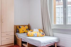 Ένα ή περισσότερα κρεβάτια σε δωμάτιο στο Family Hotel Desirée