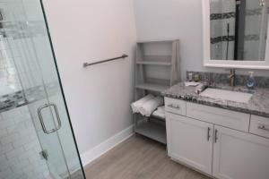 a white bathroom with a sink and a shower at Golf Views Mount Airy in Mount Airy +35 photos