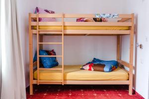 Ένα ή περισσότερα κρεβάτια σε δωμάτιο στο Family Hotel Desirée
